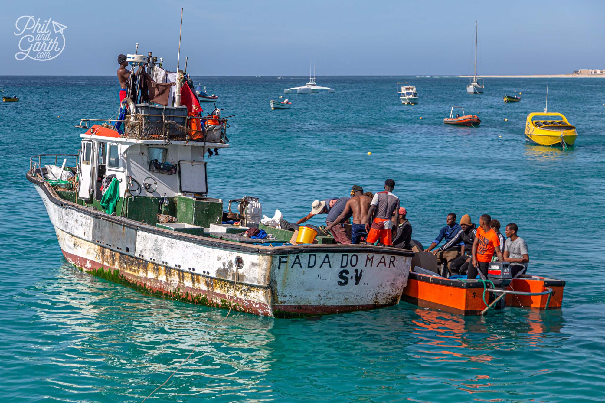 Fishermen landing their catch of the day at the pier