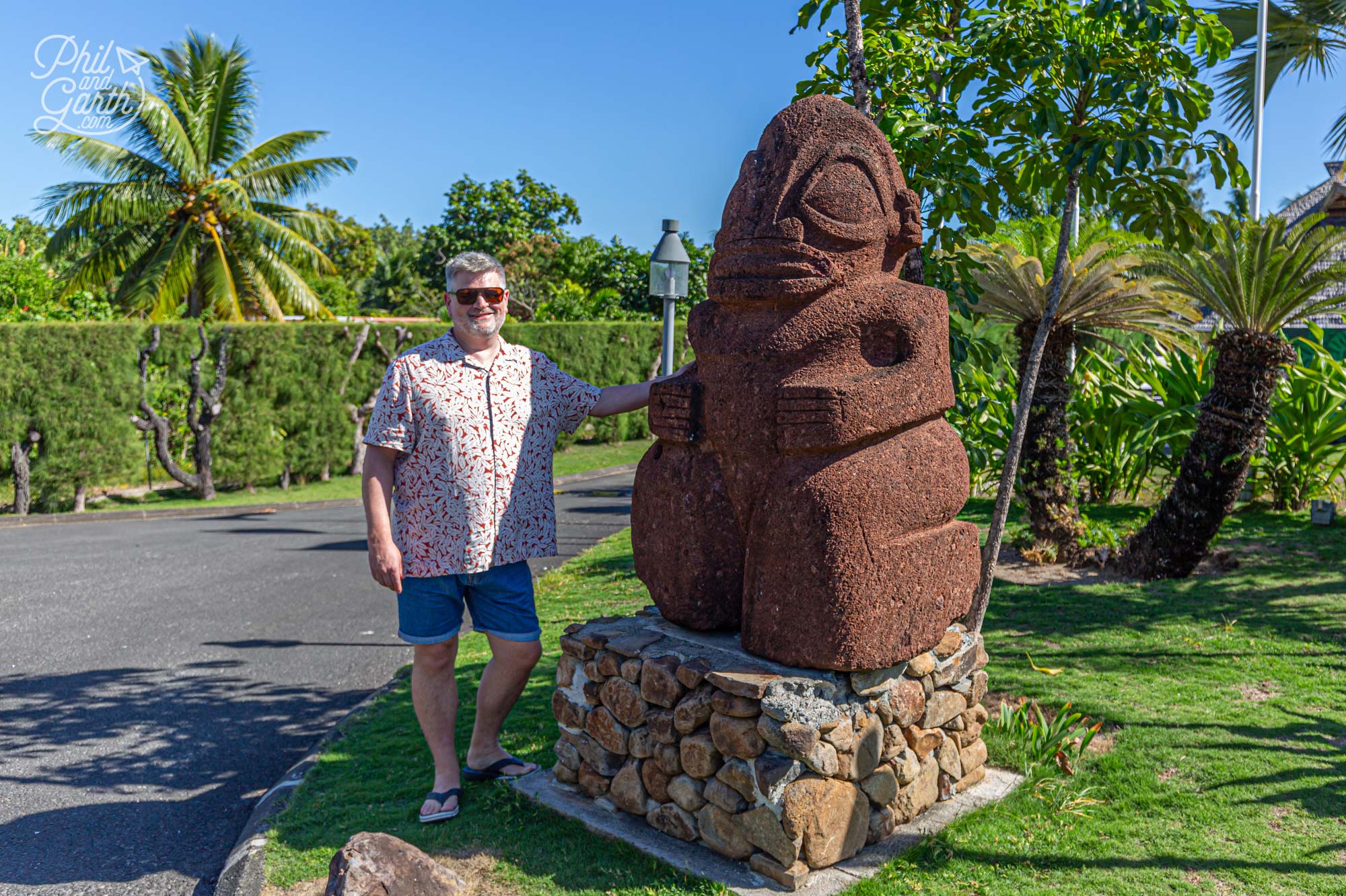 Phil posing with a tiki sculpture
