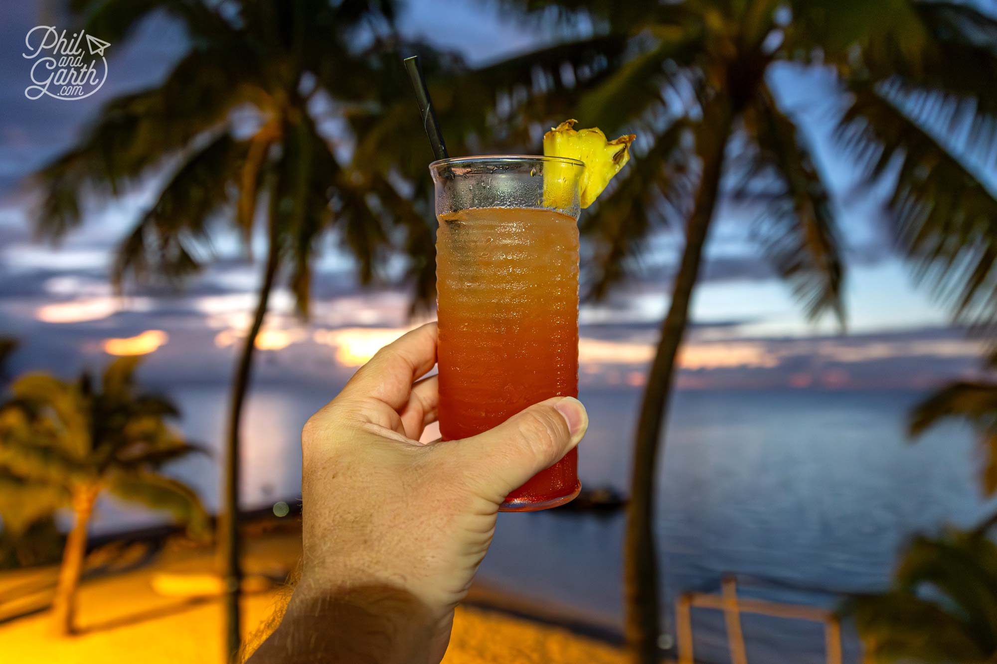 Sunset happy hour cocktails with a paradise view