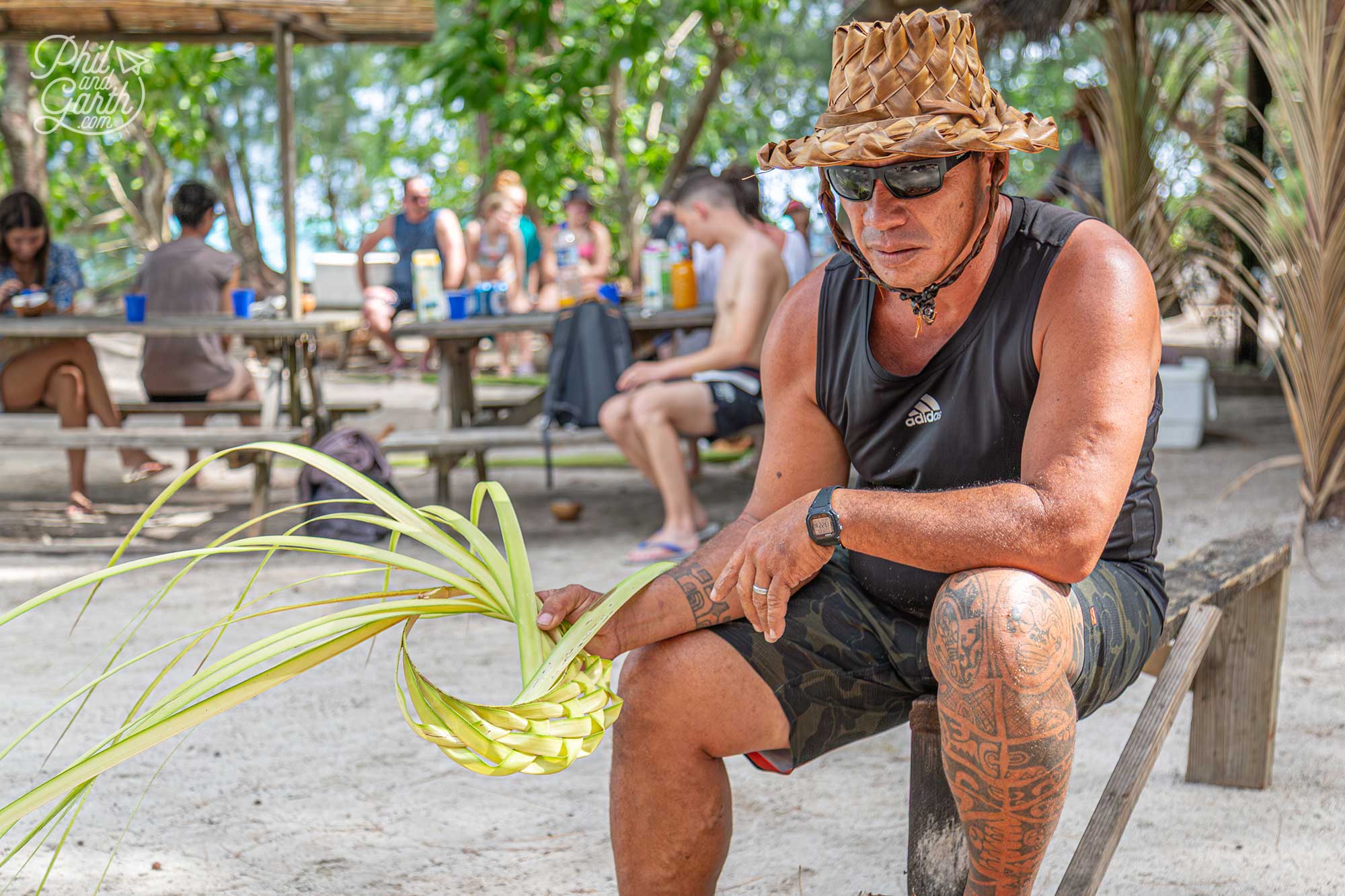 Weaving traditional Tahitian hats made from palm strands