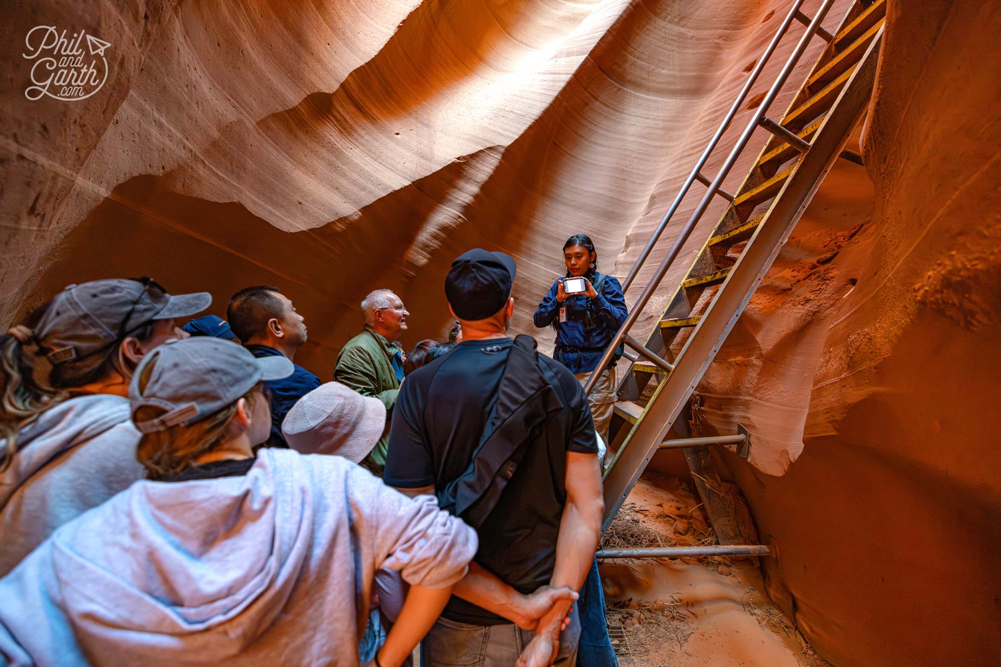 Our Navajo guide Kylie talking us through the sandstone curves formed by flash floods in Lower Antelope Canyon