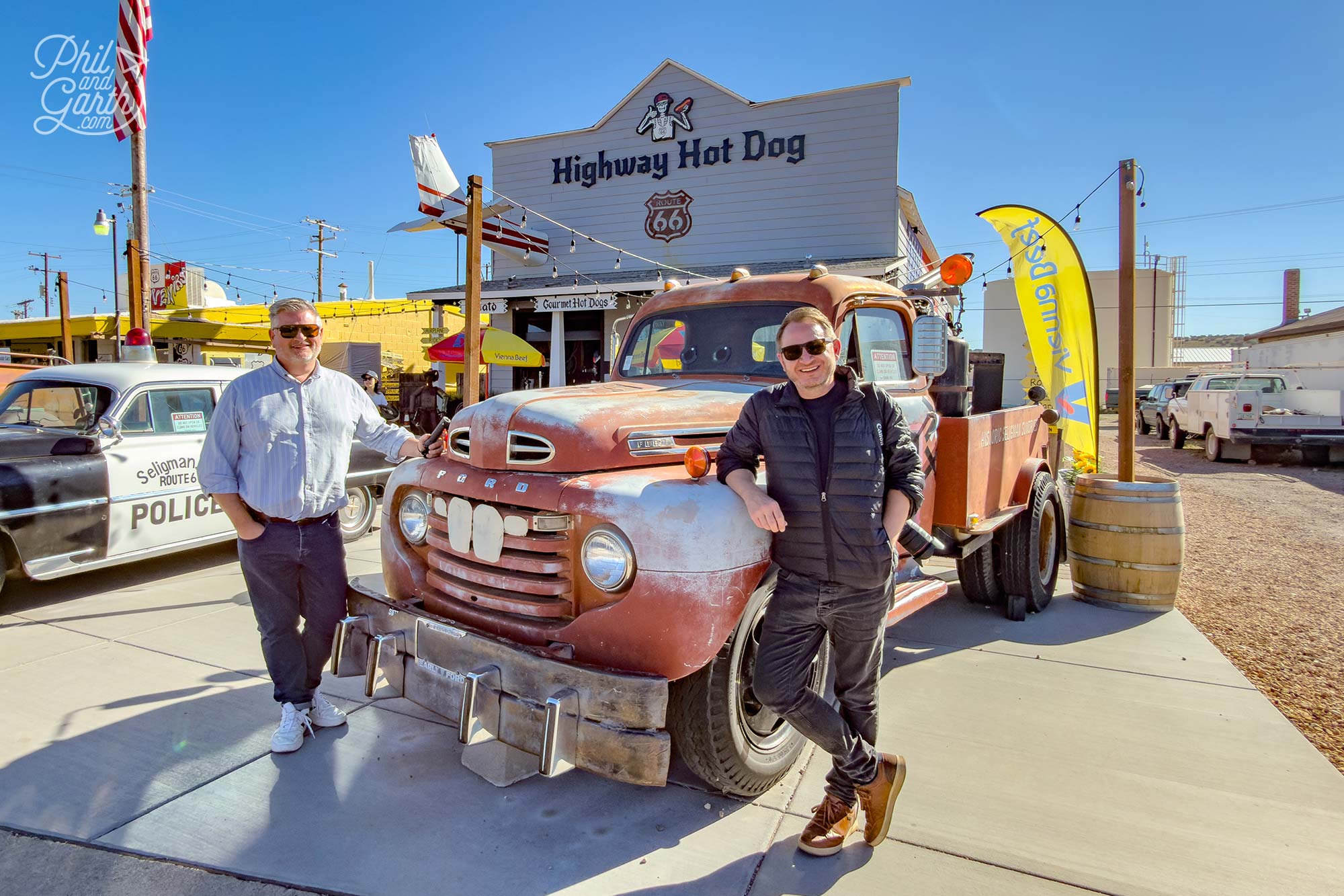 Phil and Garth next to Mater - the tow truck in Disney's Cars