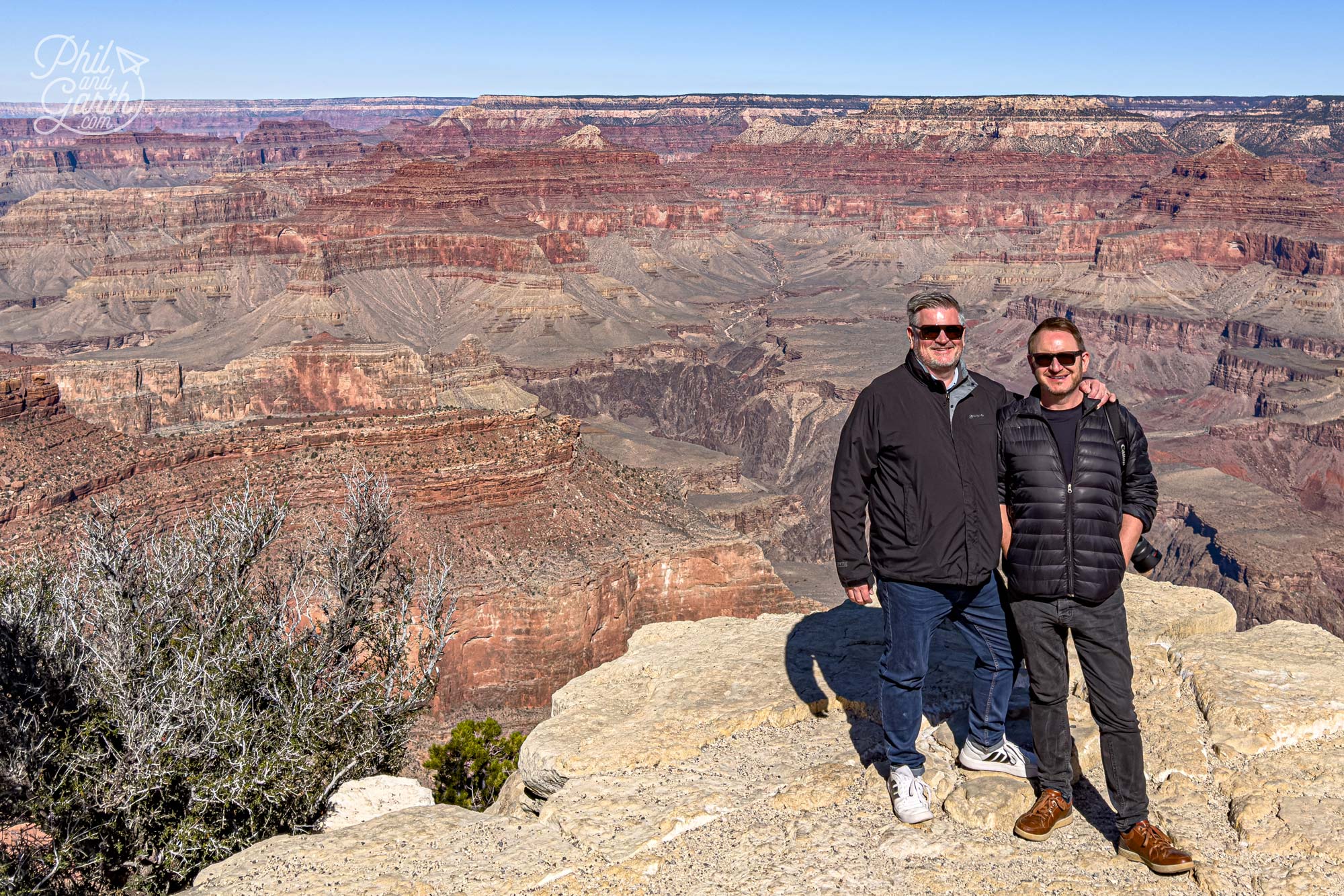 Phil and Garth with against the red rock layers of the Grand Canyon