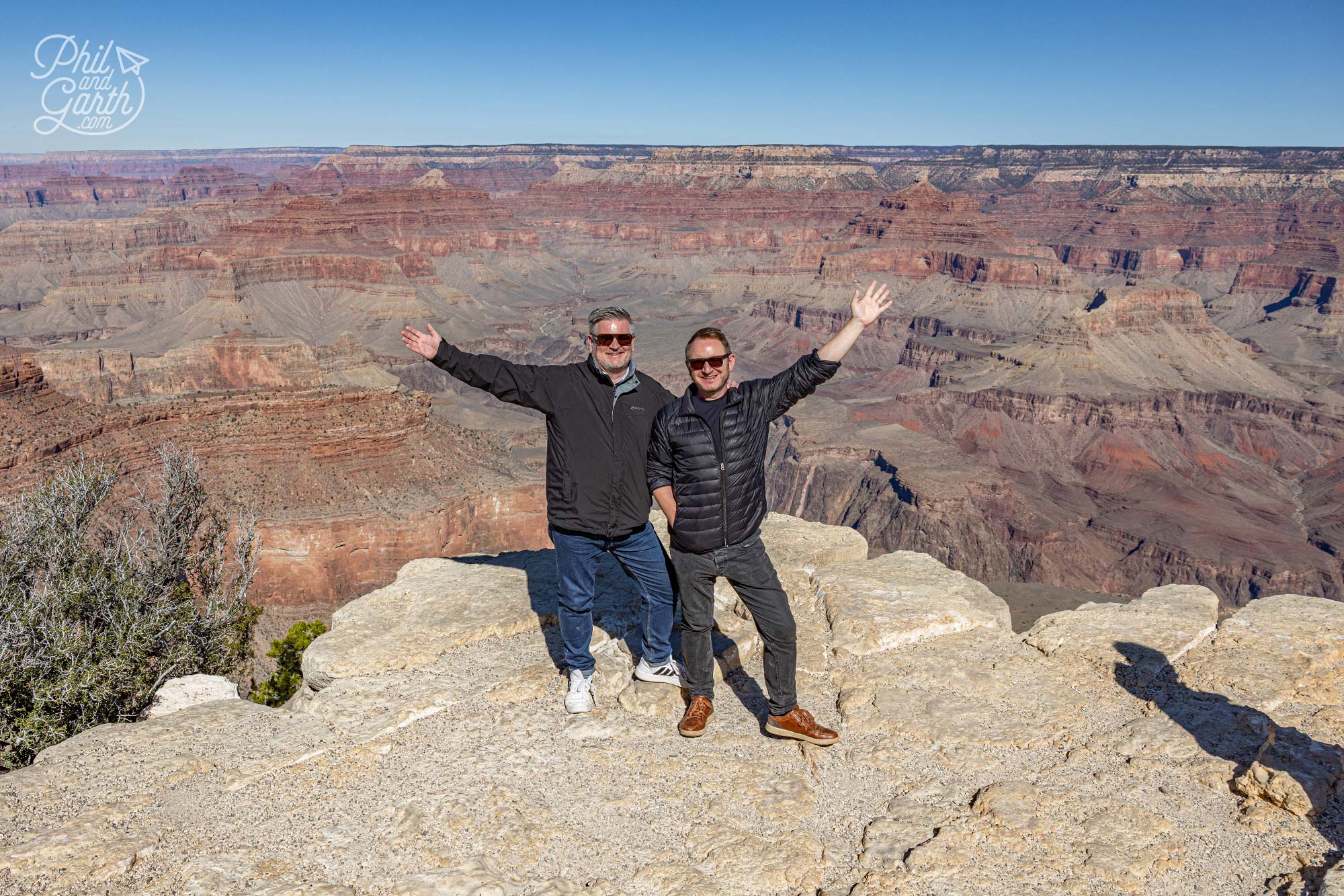 Phil and Garth with the distinct rock layers showing millions of years of geology at the Grand Canyon