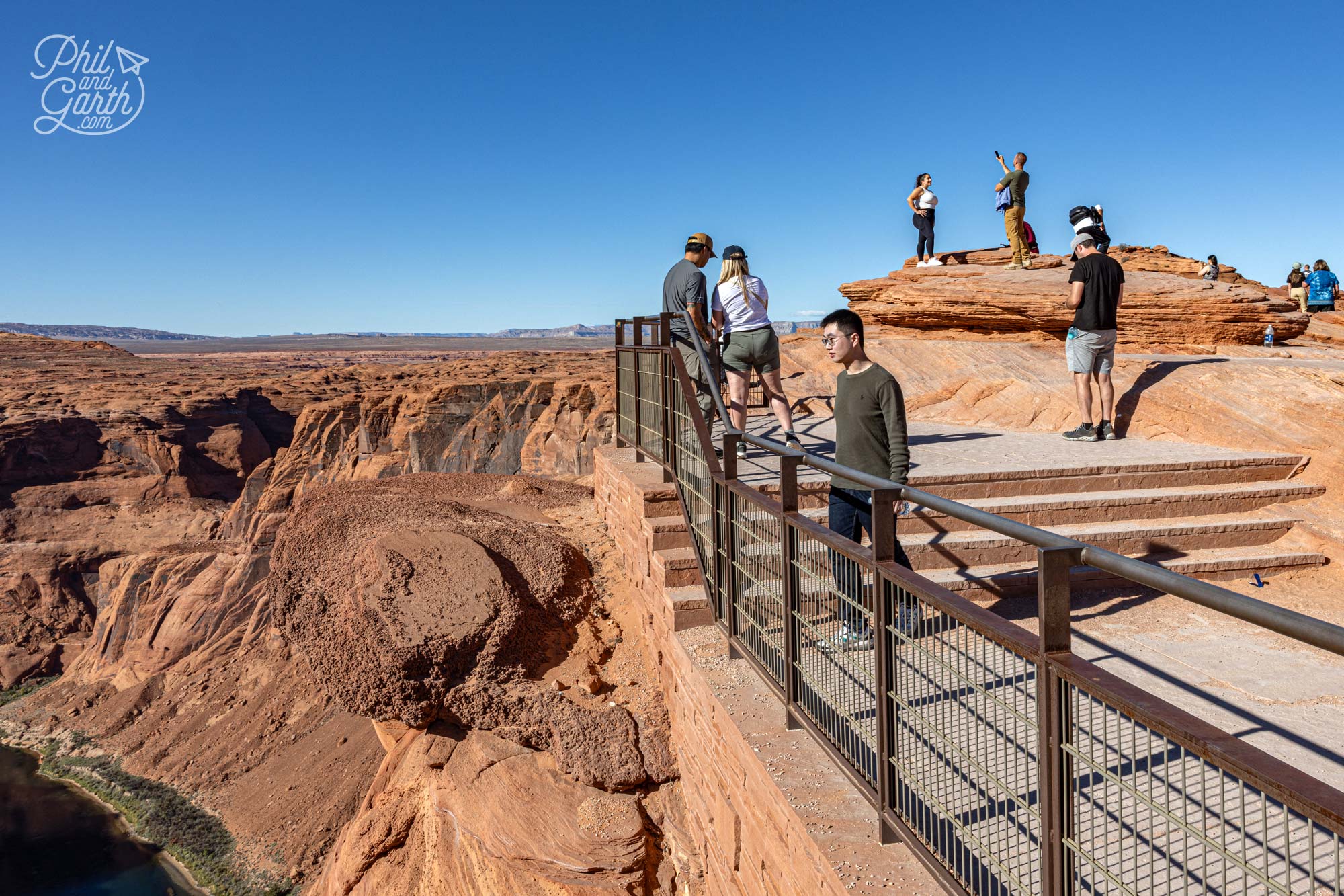 You can take a ton of good photos safelly from behind the rails