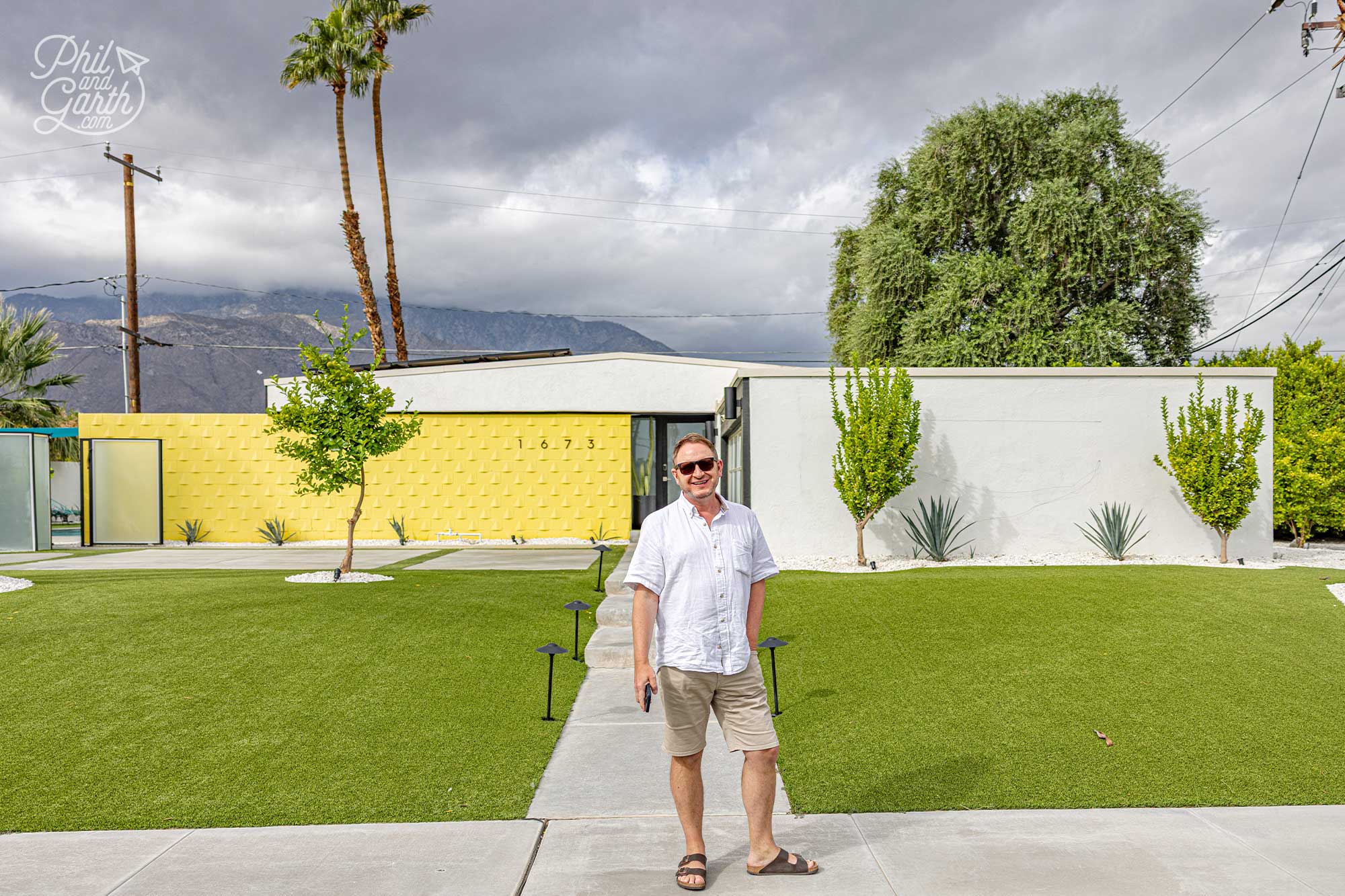 Garth outside the iconic yellow home, 1673 Via Roberto Miguel, CA 92262