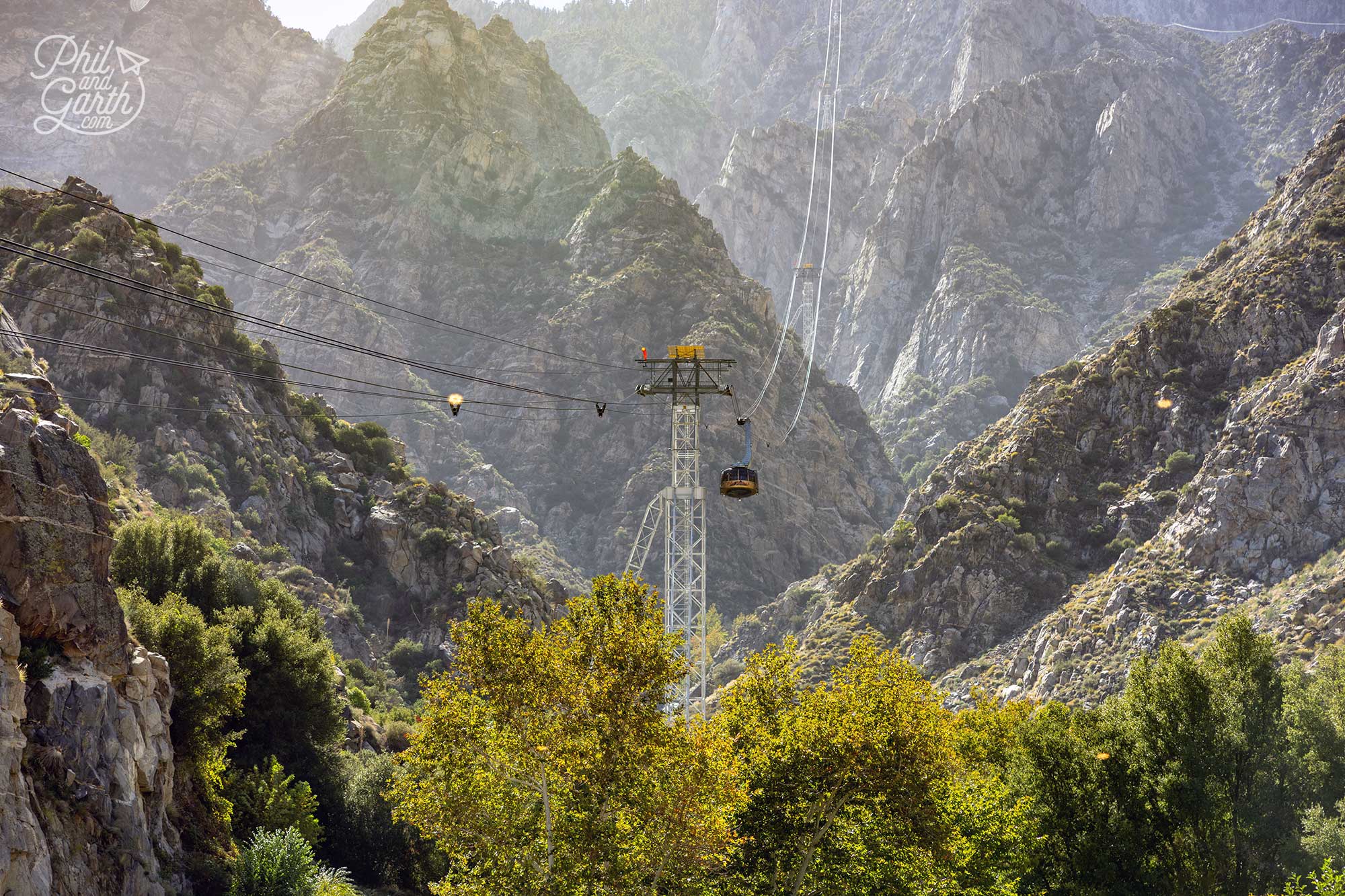 The contrast between the rugged mountains and desert below makes for incredible photos