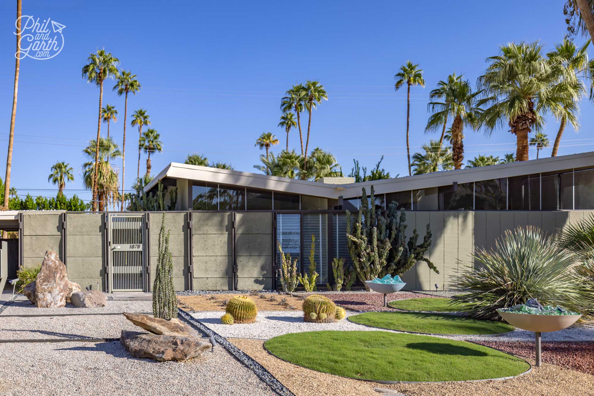 The iconic olive-green house at 1070 E Apache Road is one of Palm Springs' most celebrated mid-century modern homes