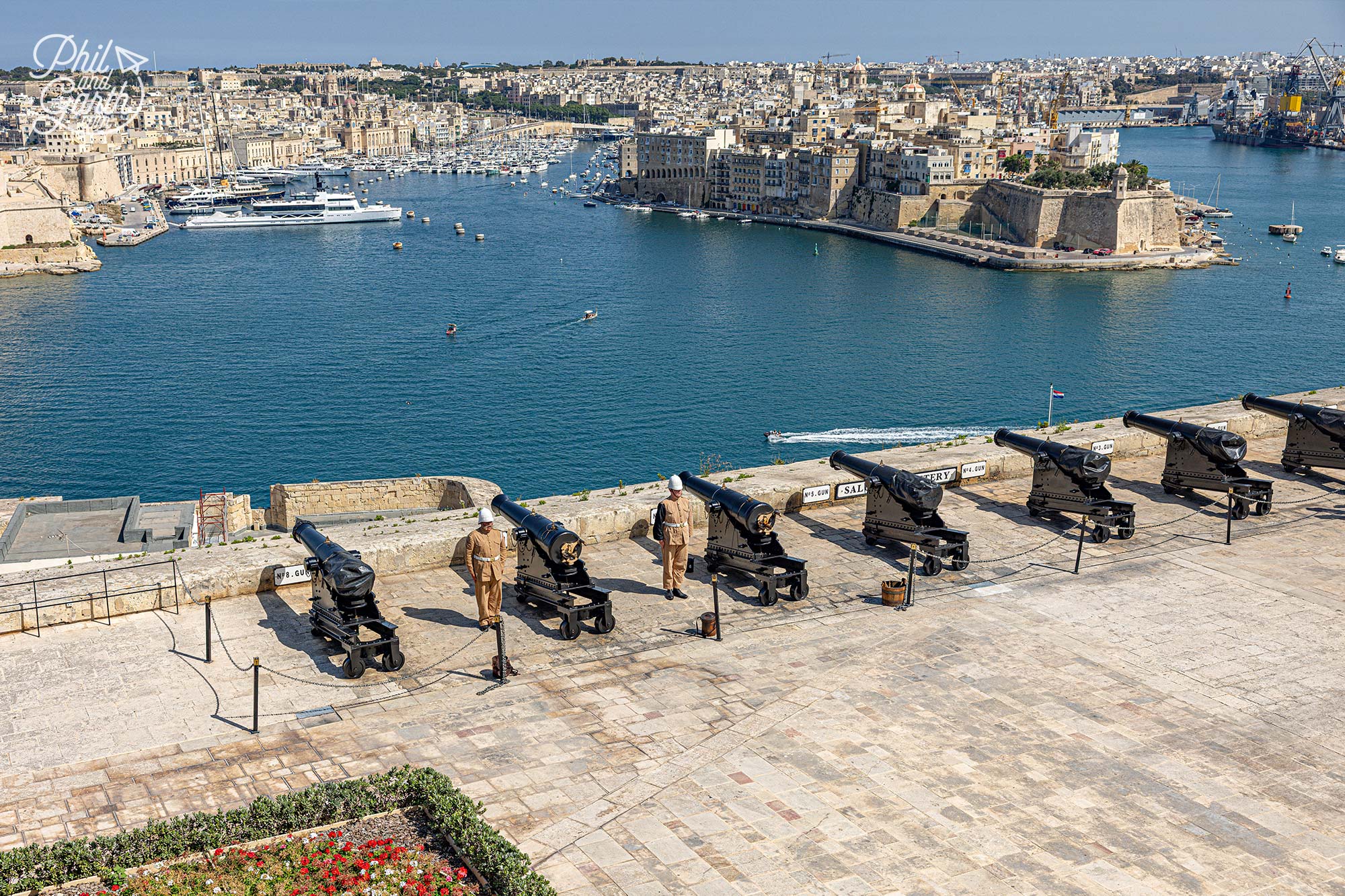 Crowds gather to watch the daily gun salute for free from the Upper Barrakka Gardens