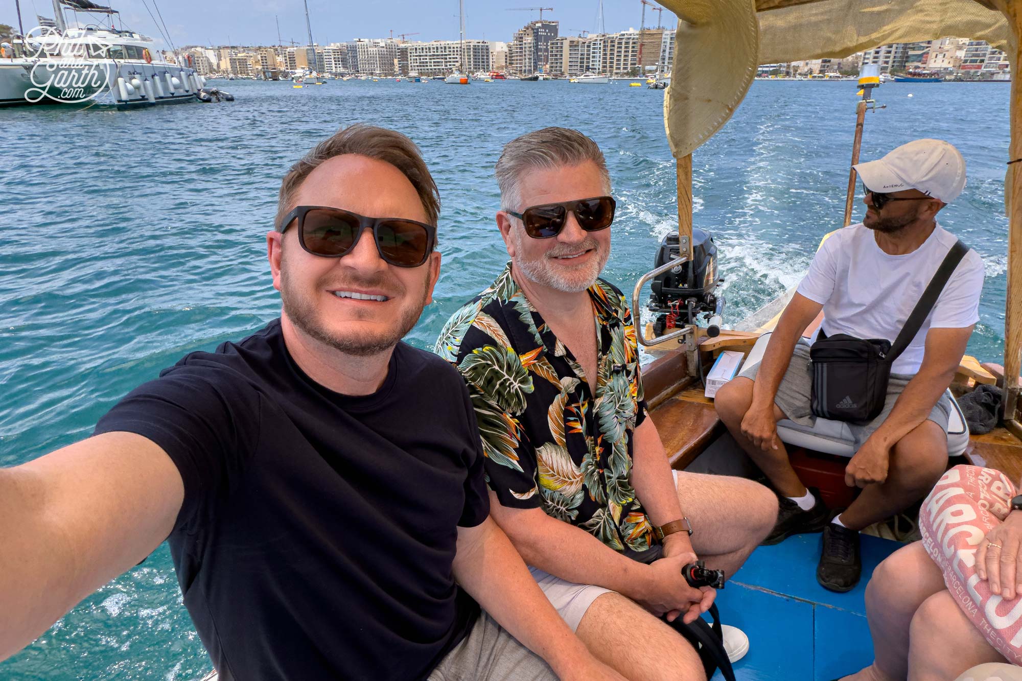 Taking a short ride on a traditional Maltese water taxi