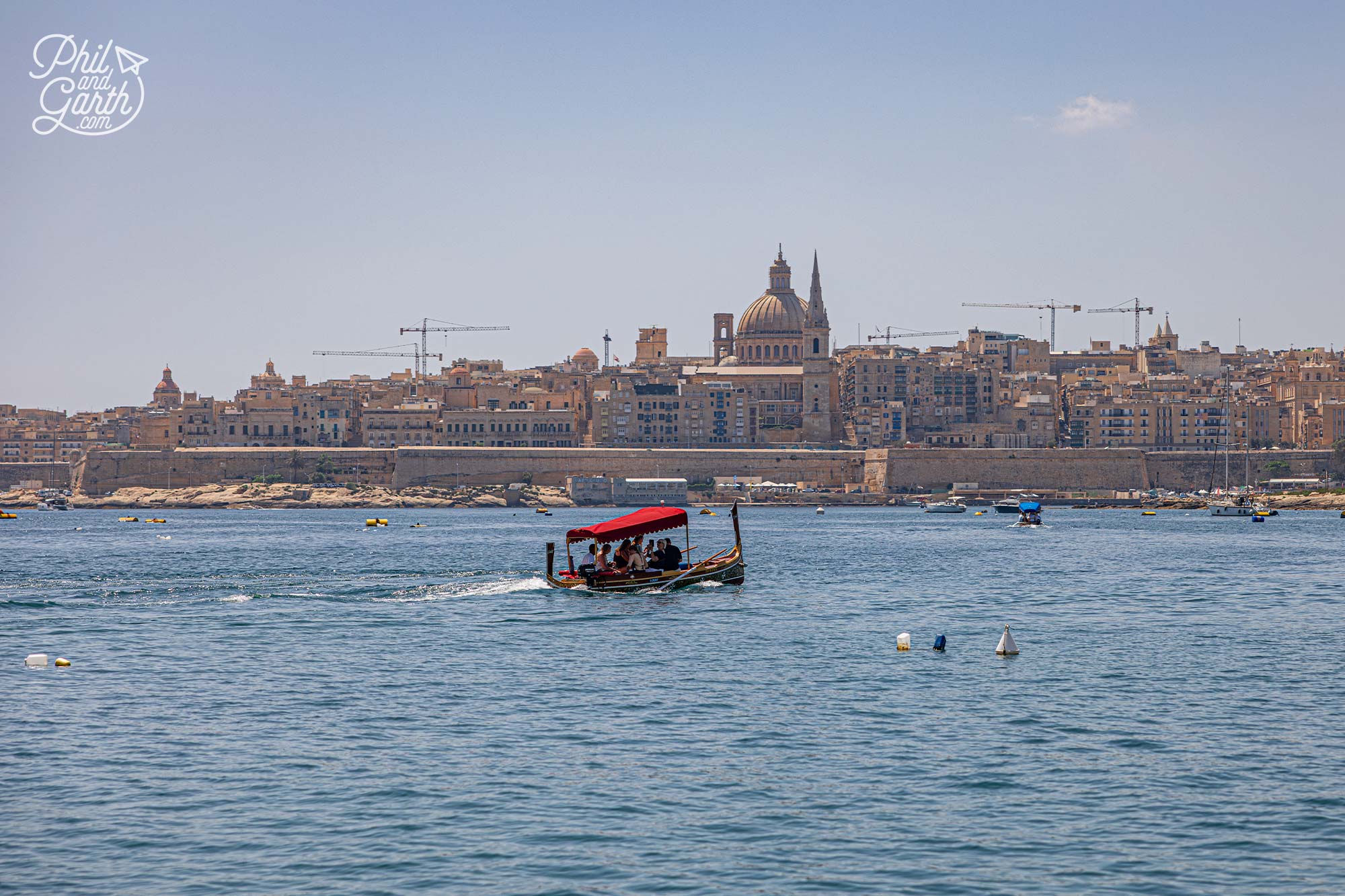 Take a traditional water taxi-to-Valletta or across the water to the three cities