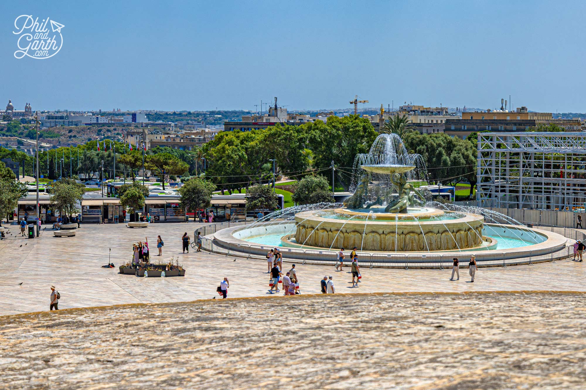The spacious Triton Fountain Square offers a striking contrast to Valletta's narrow historic streets
